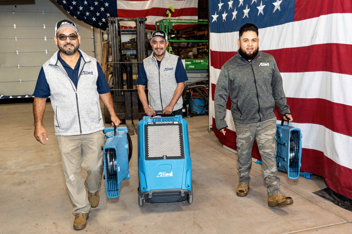 Allied Restoration technicians with LGR dehumidifiers and air movers — ready for water damage response